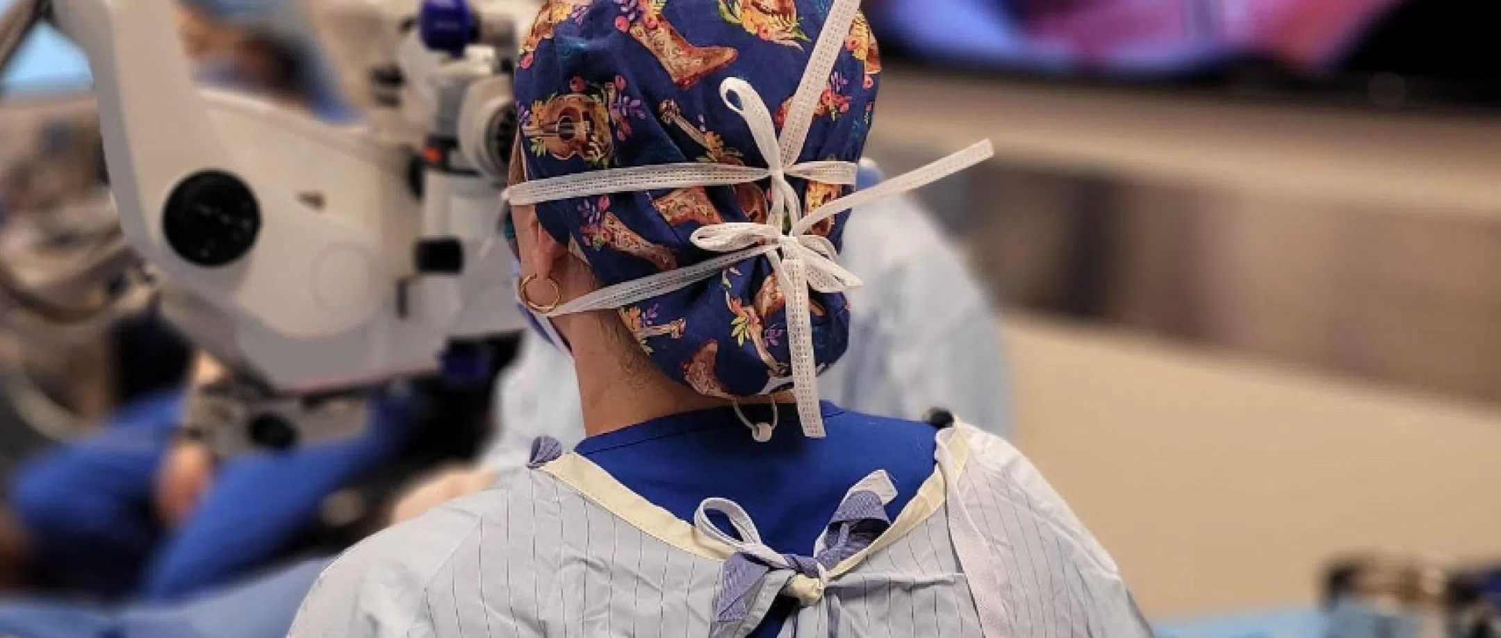 Back of the head of Sydney ophthalmic specialists gowned up ready for eye surgery